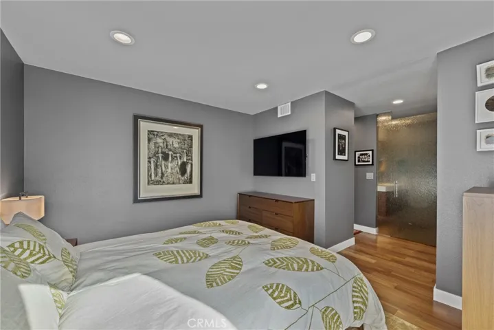 Bedroom with views of the Bathroom with Custom Rain Glass Obscured Door and Panel which opens to the spa-like bathroom!