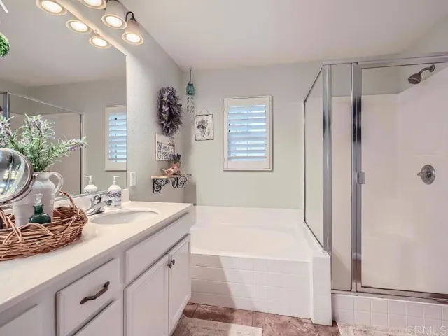 Separate shower and soaking tub. Double sink.
