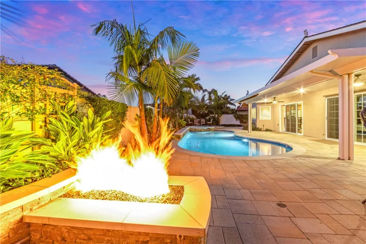 Fire pit and view of pool