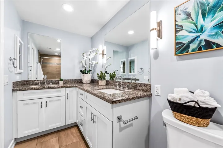 Remodeled bathroom featuring dual sinks on the vanity