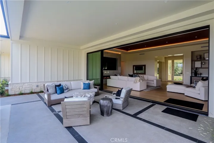 Large outdoors covered lounge area.