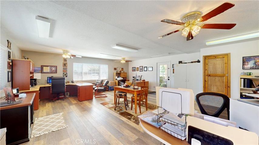 large office/bonus room with attached 1/2 bath and separate entrances from front porch and garage.