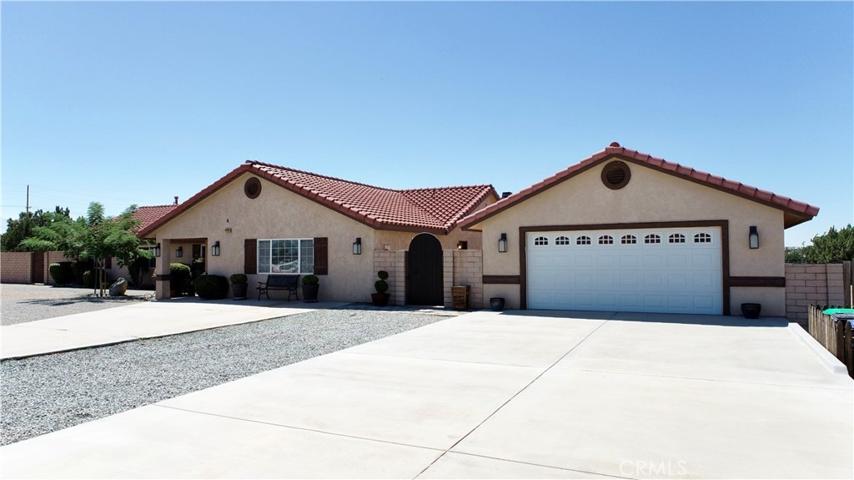 75' long full width concrete driveway. detached 25' x 40' garage. double door front entry door. 2 man-doors plus a 10' wide rear enty door with auto-roll up