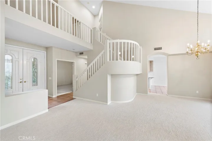 Front door beveled glass detail with the staircase and loft architectural feature