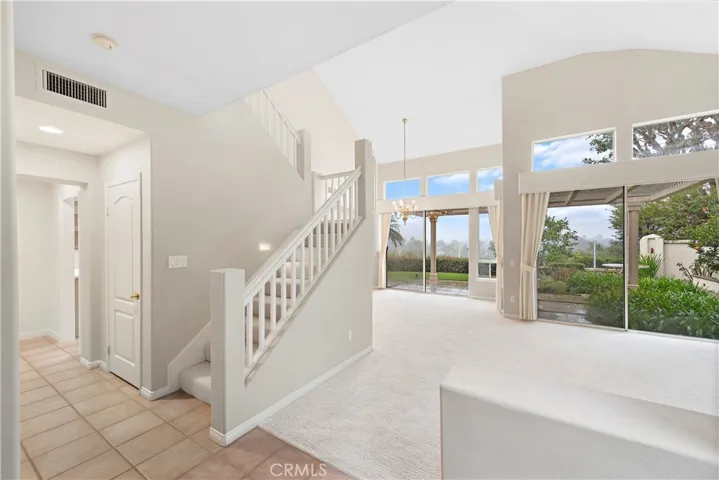 Entry to the Family Room with tall sliding doors to the view