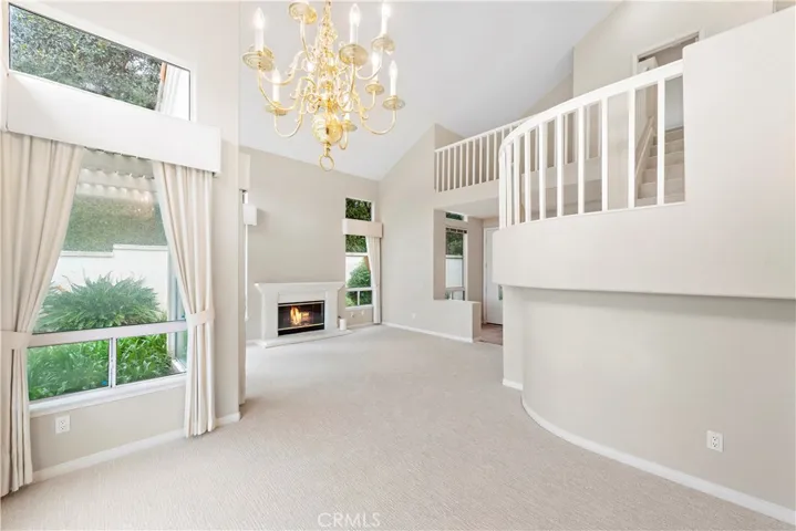 Dining Room just off the living room, also enjoys views out the tall sliding doors