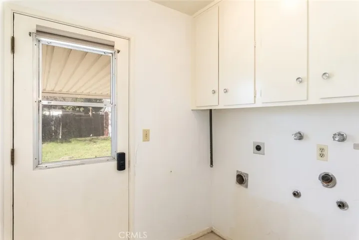 Laundry room with all hook ups and storage