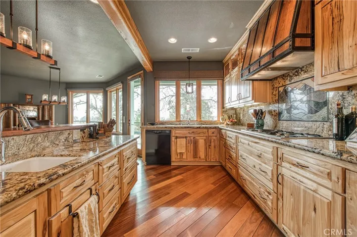 The island is custom Built with Bubinga wood counter and a bar sink.
