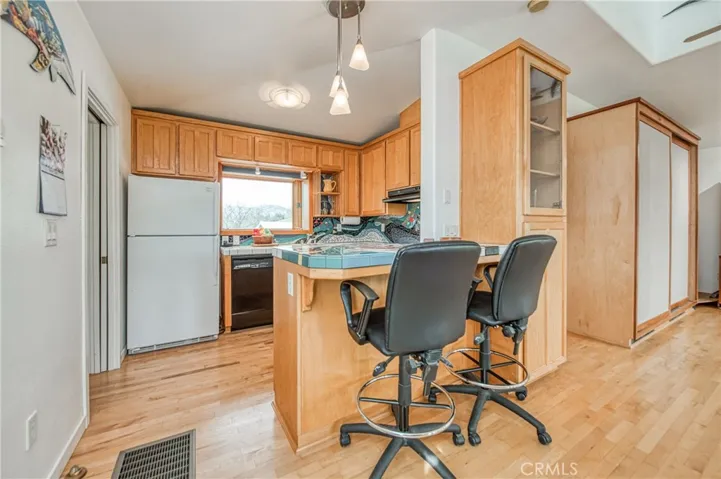 Kitchen has built in Maple cabinets