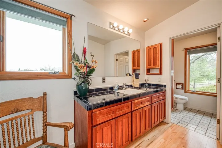 The bathroom cabinets are custom built with Cherry wood.