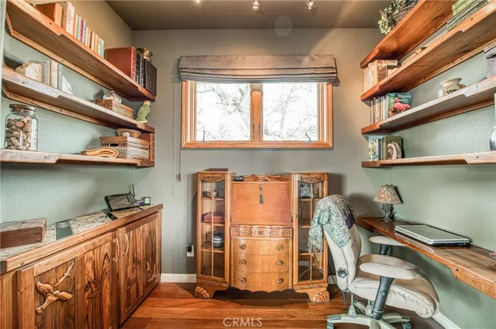 Office space with Walnut wodd custom built-in cabinets