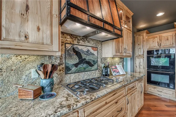 The stove hood is custom made Walnut wood.