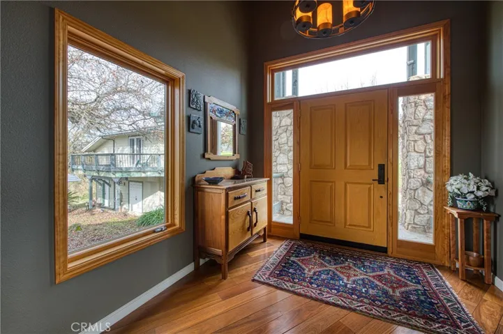 Front door showing the Brazilian wood flooring throughout the home.
