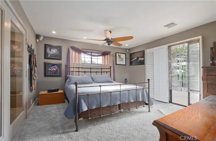 Primary suite with sliding door to large balcony