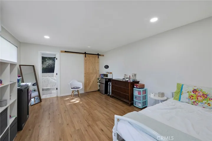 large bedroom and bathroom in apartment