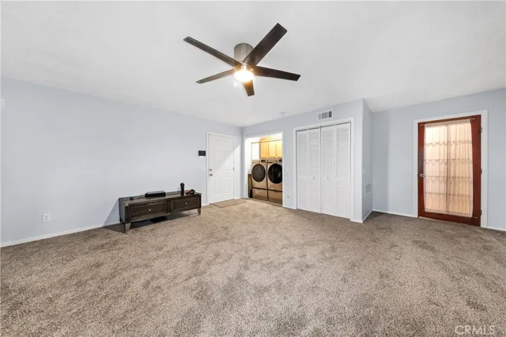 Bonus Room with washer dryer closet.  Other closet has tankless water heater and Heater unit.