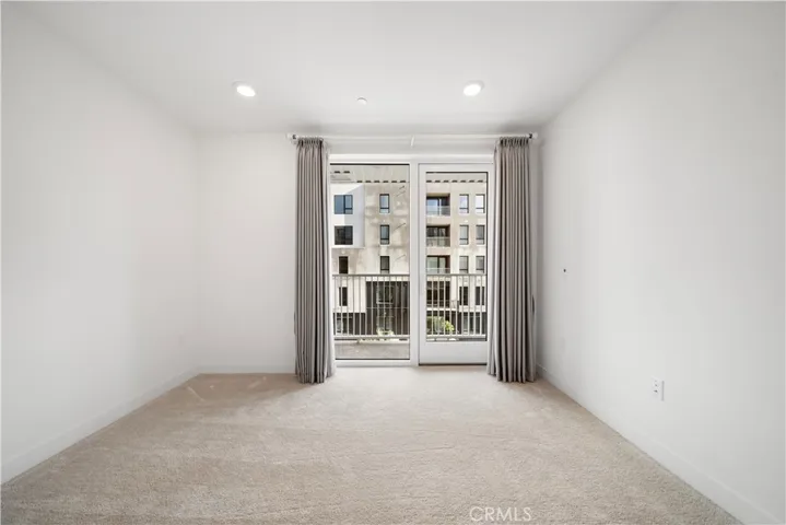 The 2nd bedroom with  sunny balcony.