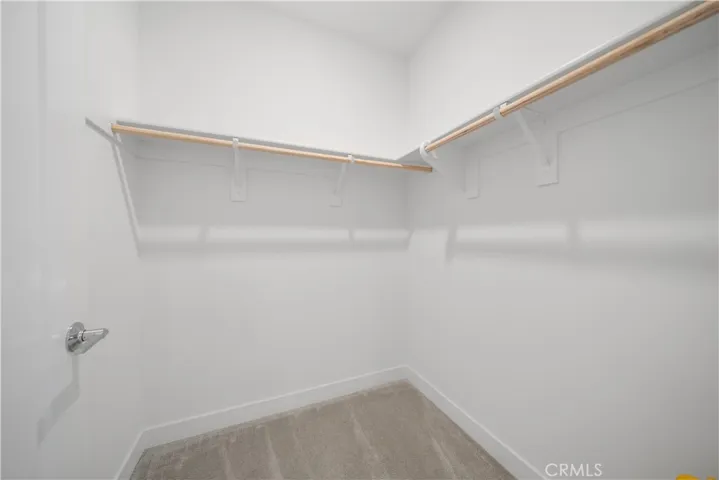 The 2nd bedroom with walk in closet .