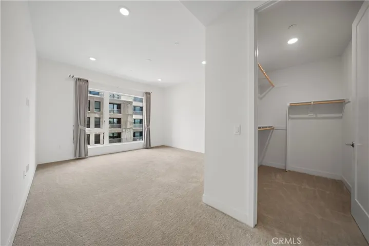Master room with big window and walkin closet.