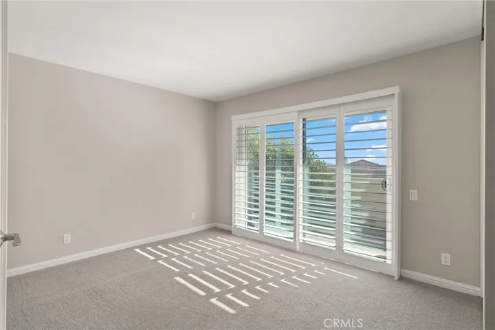 Bedroom #2 features a sliding glass door with access to a private patio.