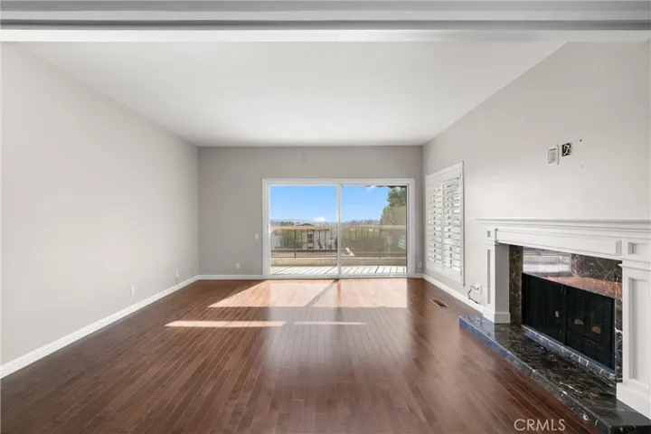 Spacious living area includes a gorgeous fireplace wired for TV placement above the mantle