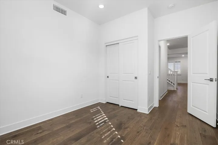 Downstairs bedroom 4  closet.