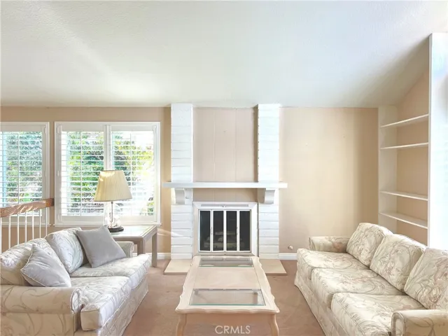 Formal Living Room with vaulted ceiling and fireplace!