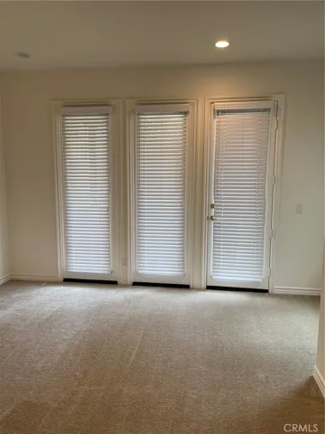 Downstairs bedroom has door to private patio