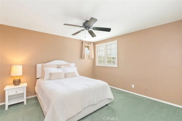 A serene bedroom basked in soft, natural light, inviting a peaceful slumber.