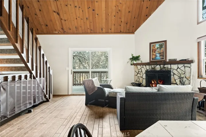 Living room, with stairs to loft bedroom