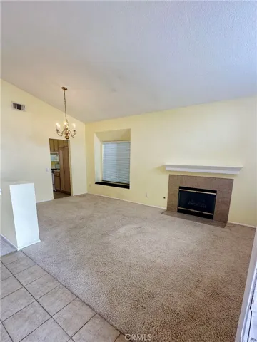 Living room with fireplace and dining area