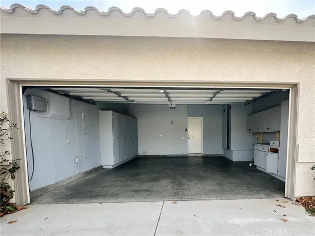 Garage with plenty of cabinets and storage