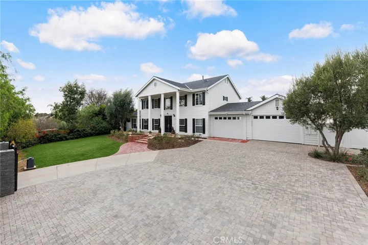 Private brick paved front yard.