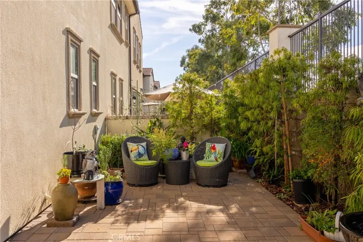 Two separate patio areas with custom interlock tiles.