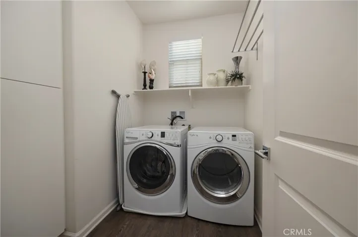 Laundry room with lots of cupboard storage space.