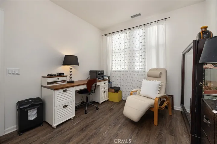 Bedroom three with custom draperies and currently using as home office.