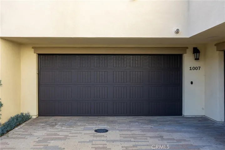 Two car garage.  This townhouse has water purification system in garage.