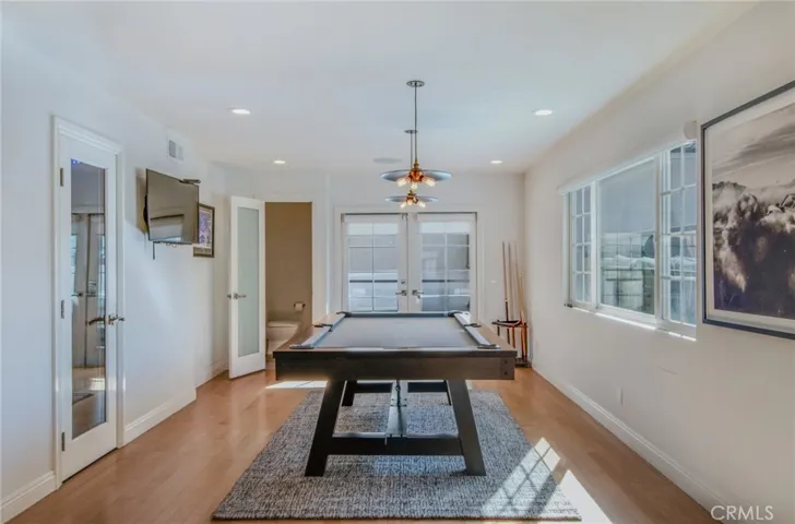 Formal Dining Room currently used as differently. Temperature Controlled Wine Room on the Left.