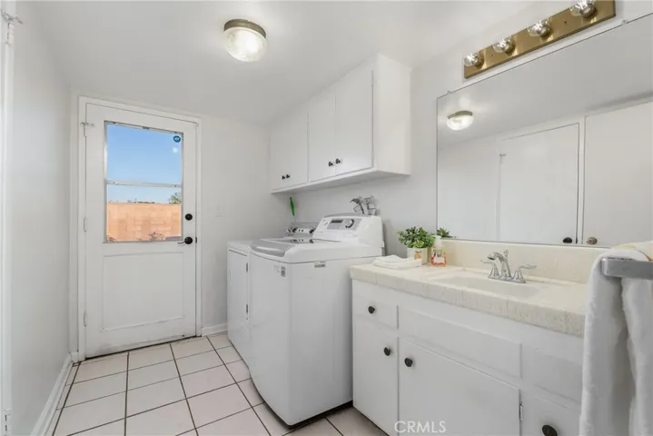 Downstairs Laundry room with back yard access and bathroom attached