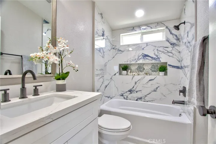Main bathroom with shower/tub combo off of bedrooms 2 and 3