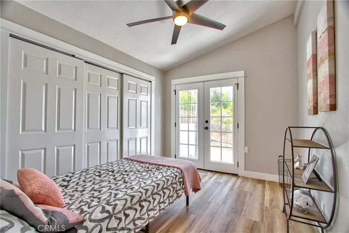 Bedroom 3 with french doors to outside of home
