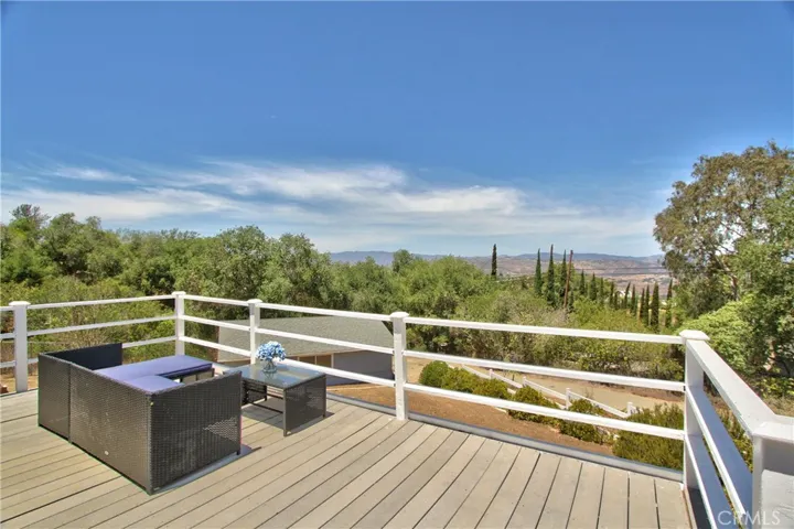 Front porch with fire-pit and mountain views.  Sit out under the stars by the fire at night.