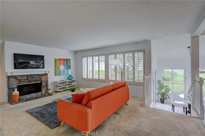 Plantation shutters open to views of the lush backyard.