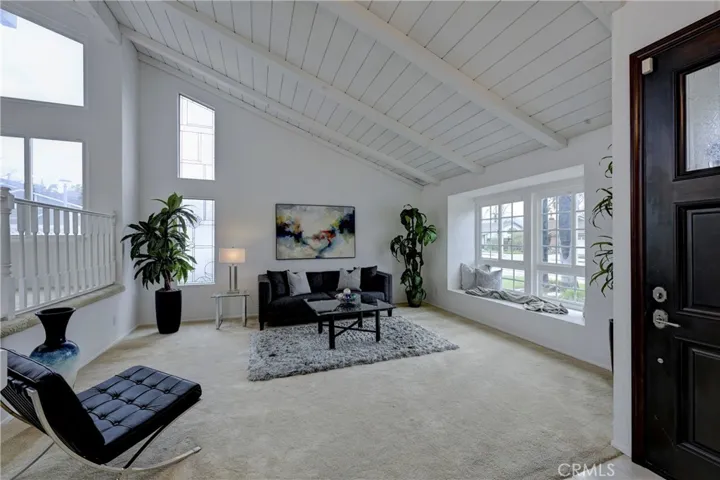 Lots of natural light streaming into the formal living room.