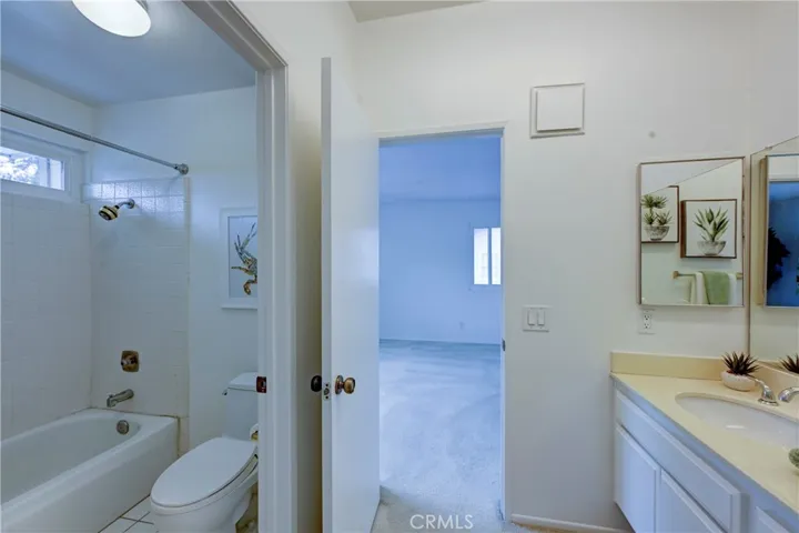 Upstairs Jack n Jill bath has private shower/tub and toilet.