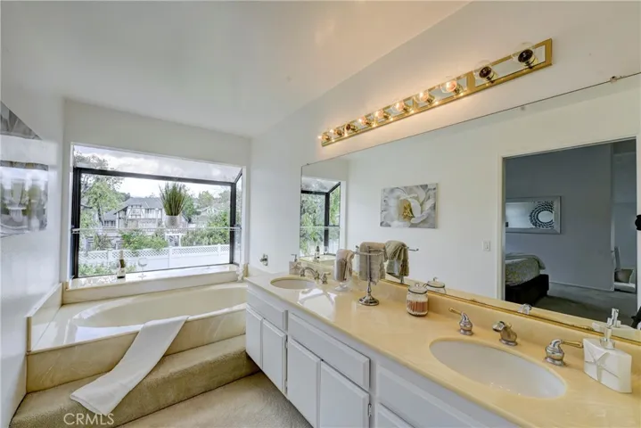 Primary bath with relaxing soaking tub and large window for lots of natural day light.