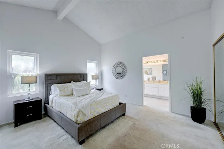 Primary ensuite bedroom with mirrored wall length closet in addition to the walk in closet off the retreat.