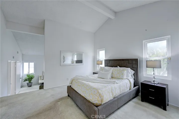 Vaulted beamed ceiling in the primary ensuite bedroom.