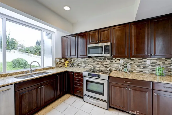 Beautiful tile backsplash in this updated kitchen.