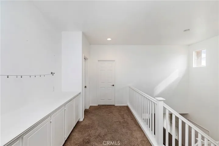 Upstairs hallway with cabinets
